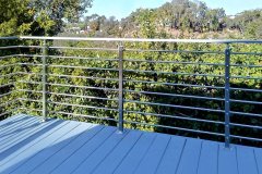 Horizontal rod railing installed on a deck in California