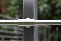 Close up of modern stainless rod railing infill fitting